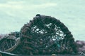 Lobster pot or cage in foreground Royalty Free Stock Photo