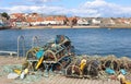 Lobster pots on side of harbour Anstruther, Fife
