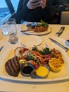 A lobster and steak dinner on a plate Royalty Free Stock Photo