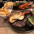 Lobster, steak, salad and chips - photo taken day 12-11-1987 Royalty Free Stock Photo