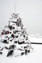 Lobster Trap Christmas Tree near Lighthouse in Snowstorm