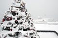 Lobster Trap Holiday Tree Covered in Snow by Maine Lighthouse