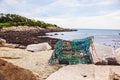 Lobster trap on rock at Oarweed Cove on Marginal way path along the rocky coast of Maine in Ogunquit Royalty Free Stock Photo