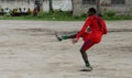 Local african soccer team during training on sand playing field