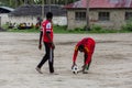 Local african soccer team during training on sand playing field