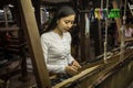 Local Amarapura woman weaving hand-made tradional myanmar fabric at weaving factoryin Mandalay Myanmar Royalty Free Stock Photo