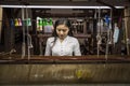 Local Amarapura woman weaving hand-made tradional myanmar fabric at weaving factoryin Mandalay Myanmar Royalty Free Stock Photo