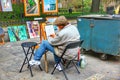 Local artist creating painting art at weekend walking street