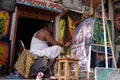 Local artist painting canvas pictures which are sold to tourists, Pushkar, India Royalty Free Stock Photo