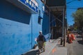 Local Asian man walking down Prince Street in downtown Flushing Chinatown