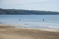 Local Balinese fishermen in the sea at Jimbaran Beach in Bali, Indonesia. Royalty Free Stock Photo