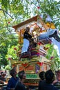 Local Balinese holy man rides the funeral pyre