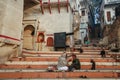 Local barbershop in Varanasi benares with a special stray dog audience, Uttar Pradesh, India