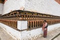 Local Bhutanese turning prayer wheels