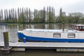 Local boat docking at Riverside Walk promenade by the River Thames in Kingston, England