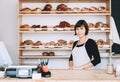 Local business owner or bakery worker behind the counter Royalty Free Stock Photo