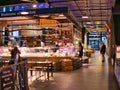Local butcher counters and their customers in the new Market Hall in Preston, Lancashire, UK Royalty Free Stock Photo