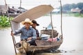 Local Cambodian couple rowing along Tonle Sap lake, Puok, Siem Reap Province, Cambodia