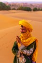 Local camel handler, in the sand dunes of Merzouga Royalty Free Stock Photo