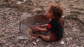 Local child playing at the beach in Cape Fatucama in Dili, East Timor.