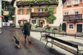 Local citizen on town square in Hallstatt, Austria.