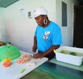 Local cook prepares traditional Bahamian conch salad in Caribbean restaurant in Harbor Island, Bahamas