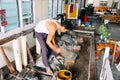 Local craftsman making gold leaf in Mandalay.