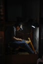 A local craftsman works in his tiny shop in Fez, Morocco.