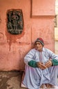 Local Devotees resting near Vintage Antique Stone Carved Tablets outside the wall of Sree Gaya Royalty Free Stock Photo