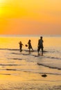 Family Silhouette, Yellow/Orange, Fisherman and young children, Flores, Indo, Asia Royalty Free Stock Photo