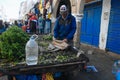 A local farmer sells produce in Essaouira, Morocco.