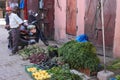 A local farmer sells produce at a old madina in Morocco.