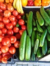 Local farmers markets vegetables showcase with ripe organic tomatoes and cucumbers. Top view. Healthy eating. Vegan food