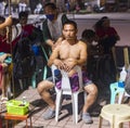 Local Filipino man receives shoulder massage treatment,along the popular Rizal Boulevard