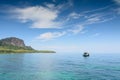 Local fisherman boat floating in tropical sea near the island Royalty Free Stock Photo