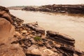 A local fisherman casting the fishing net in the Mekong River, fantastic scenery of steep by the river Royalty Free Stock Photo