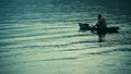 A local fisherman is checking his net for fishes in Samosir Island, Toba Lake, North Sumatra, Indonesia. Royalty Free Stock Photo