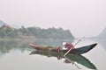 Local fisherman are fishing with his small boat on the Trang An river Royalty Free Stock Photo