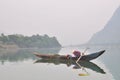 Local fisherman are fishing with his small boat on the Trang An river Royalty Free Stock Photo