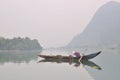 Local fisherman are fishing with his small boat on the Trang An river Royalty Free Stock Photo