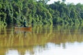 Fisherman in Kinabatangan River in tropical forest of Borneo , Malaysia