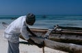 A local fisherman and his boat, Zanzibar Royalty Free Stock Photo