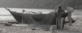 Local fisherman readying his small fishing boat on agonda beach in goa, India Royalty Free Stock Photo