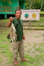 Local fisherman standing with fish by visitor center on Rinca Is