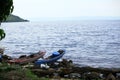 Local fishermen boats were harbored in the rocky beach in Toba Lake, North Sumatra, Indonesia Royalty Free Stock Photo