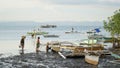 Local fishermen with fishing boat at the port of Tubigon on the Philippines island of Bohol, Southeast Asia.