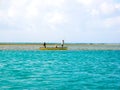 Fishermen in a small boat going to sea in Rodriguez and Mauritius islands - Indian Ocean.