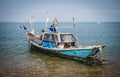 Local fishermen preparing a boat to go fishing on the beach of Ban Bang Saray, Thailand