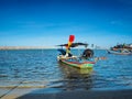 Local fishing boats dock on the shres on a clear day Royalty Free Stock Photo