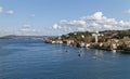 Local Fishing Boats moored in front of the Summer Mansions and Grand Apartments of the Bosphorus Straits